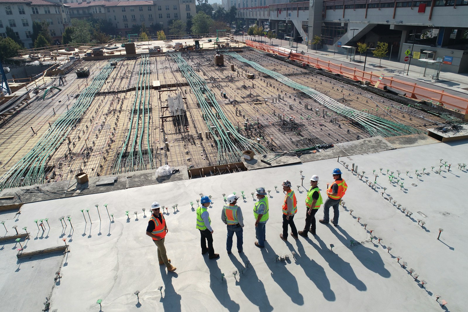 Construction crew on a concrete deck at a California building site